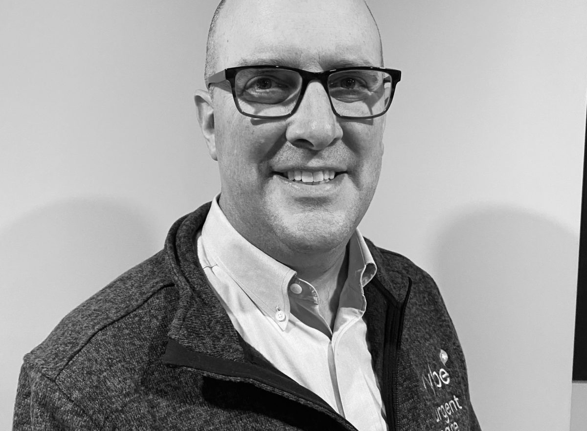 Headshot photo of a vybe urgent care chief operating officer Chris Marchese.