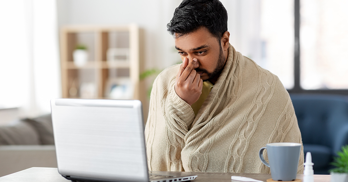 Sick man looking up his illness online